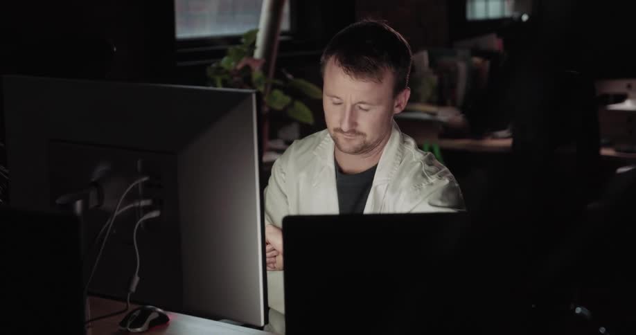 A man sitting at a computer concerned
