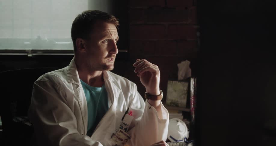 A doctor types on a keyboard