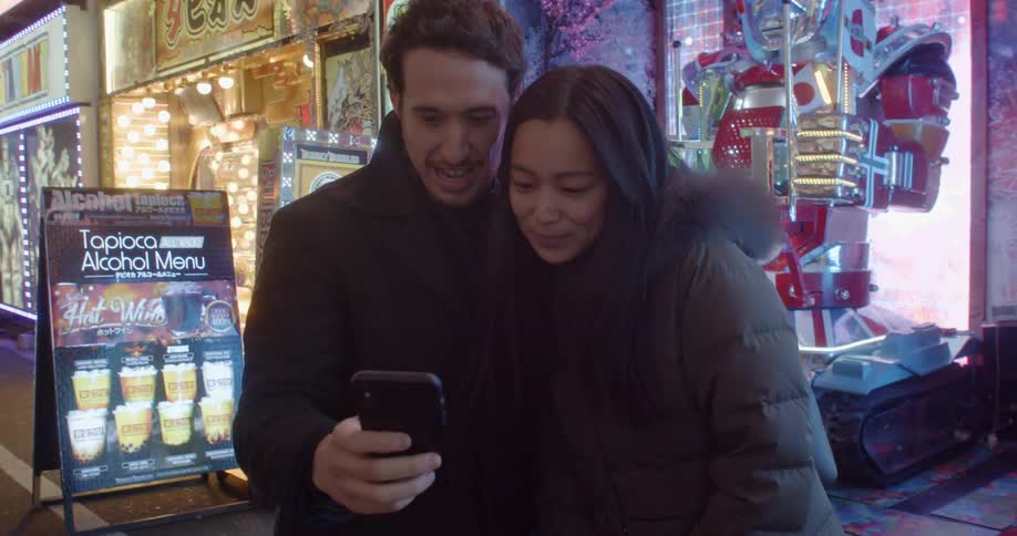 Couple take selfie near robotic display