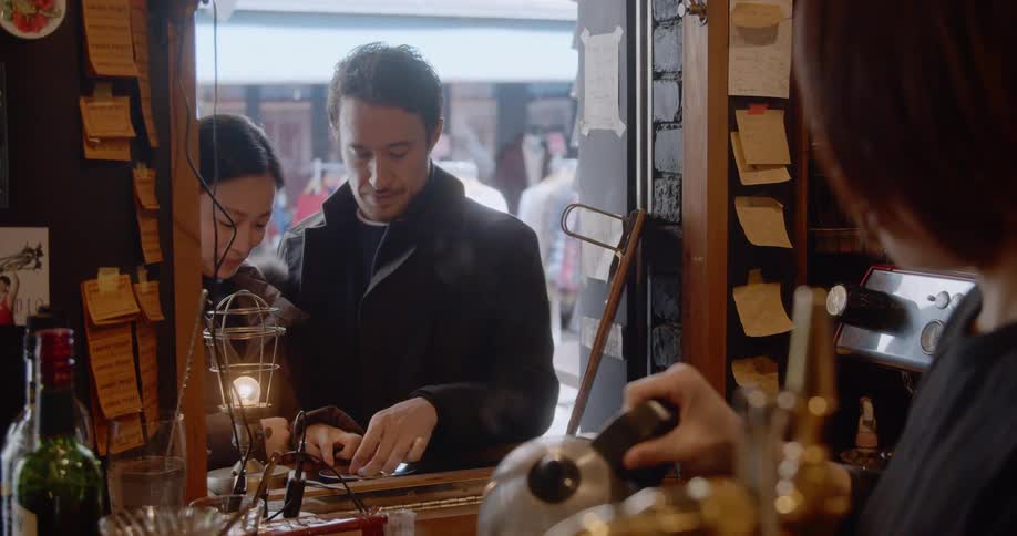 Couple buy hot beverage from a street vendor in japan