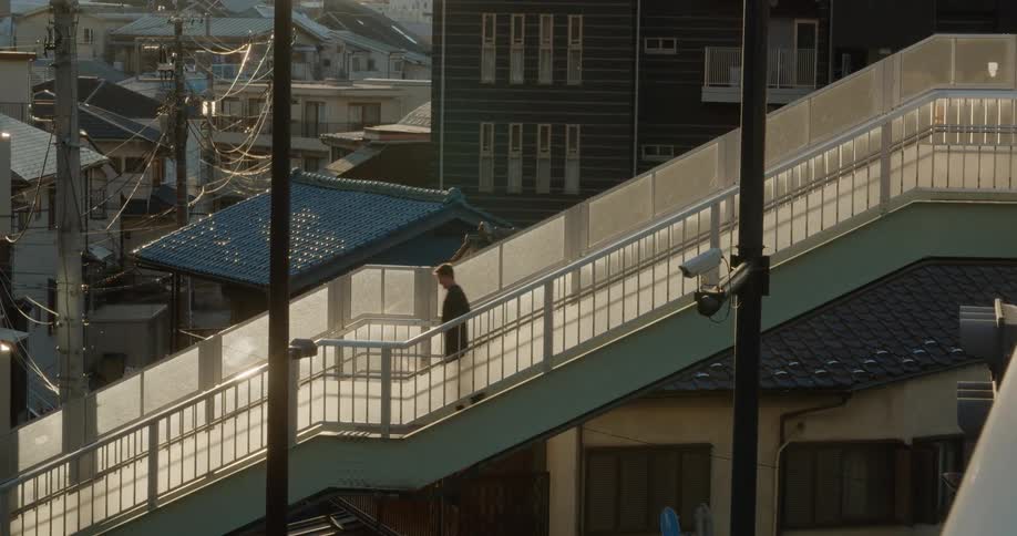 A person is walking down steps outdoors