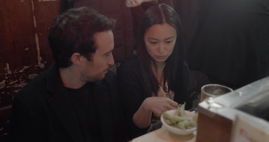 People talk while sitting at a restaurant