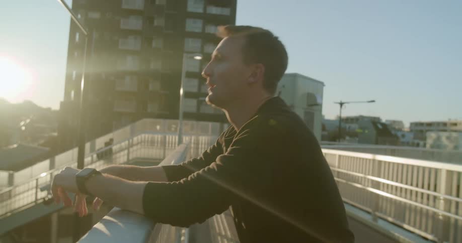 A man leaning on a railing