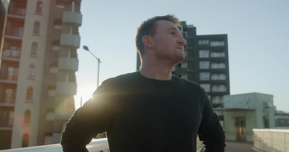 A man stretching outside