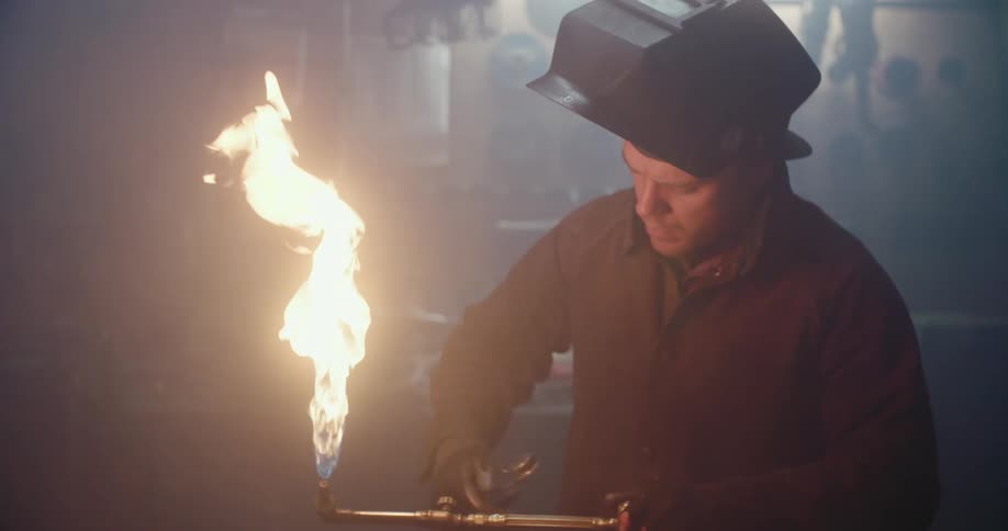 A man is working in a factory shop