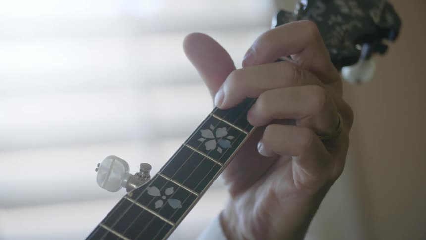 A man plays the guitar