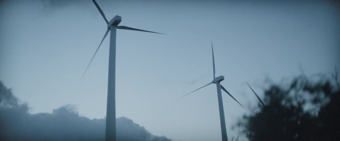 The wind blows fast as the windmills turn