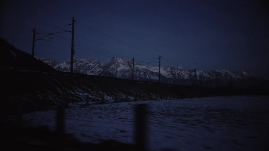 Mountain range covered in snow at night