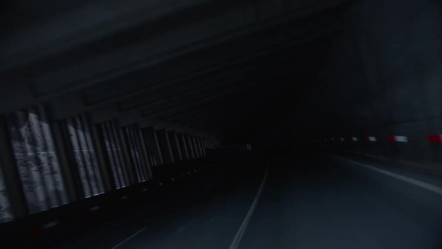 A tunnel at the base of a mountain