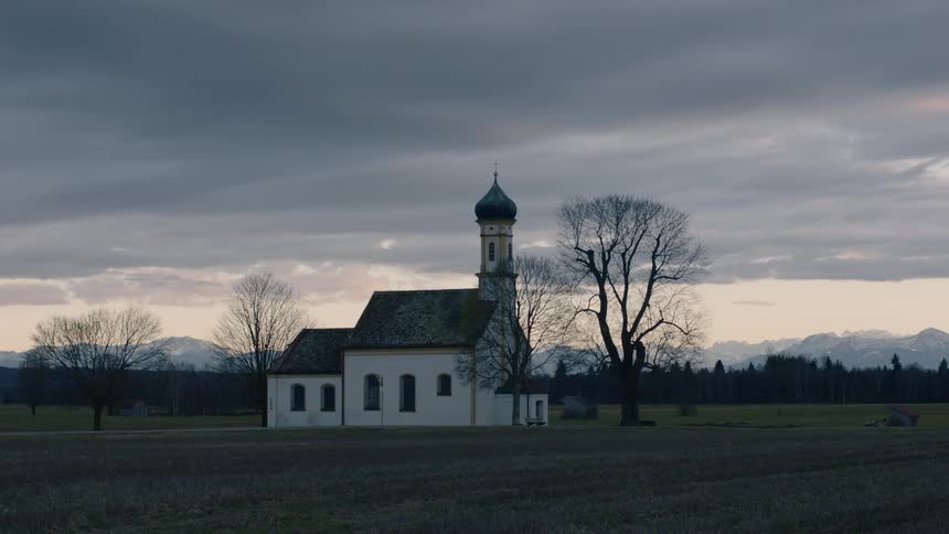 A church sits on a field