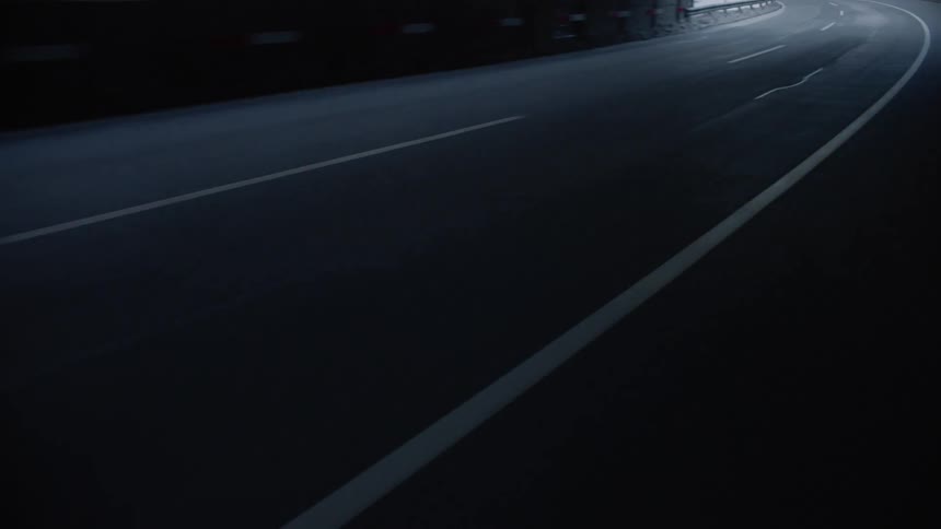 Vehicles drive down the road