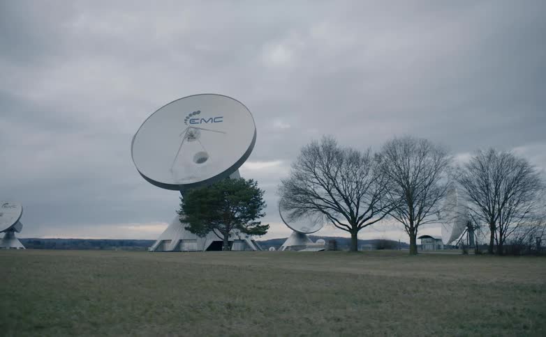 Large satellite dishes line the field