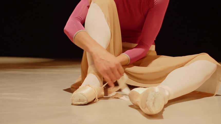 A ballerina dressing