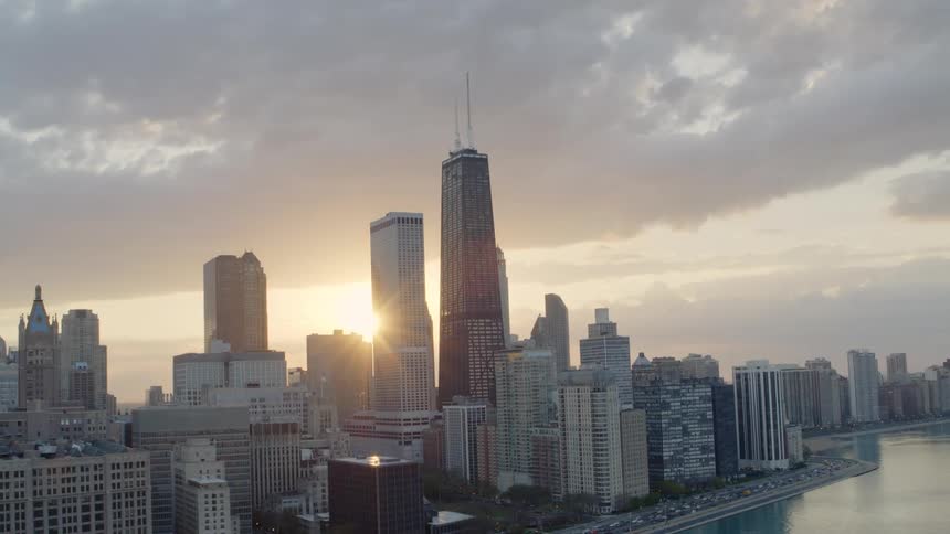 The sun rises over downtown Chicago