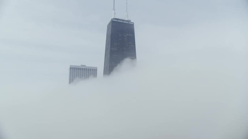A Chicago skyscraper rises above the clouds