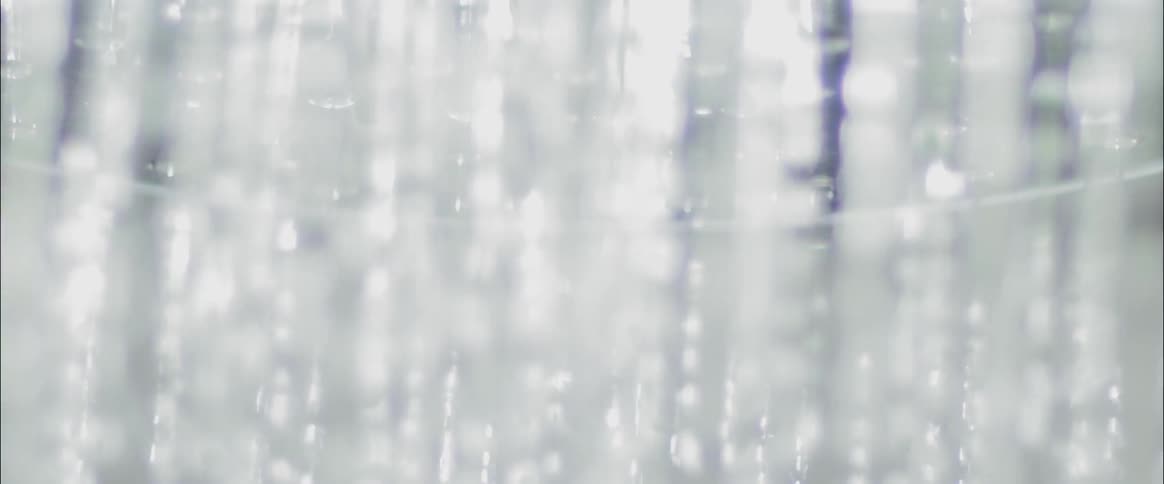 Water falls from a shower head