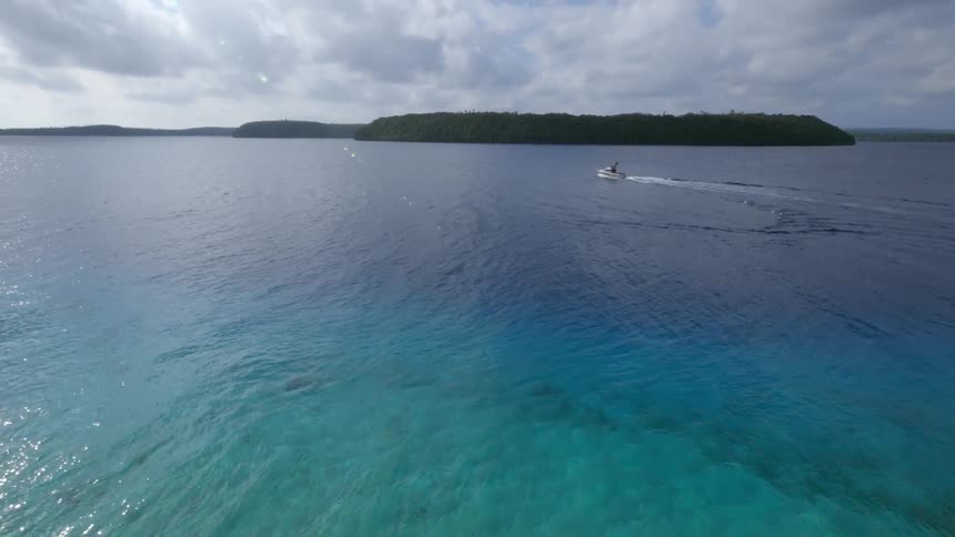 A boat in clear ocean waters