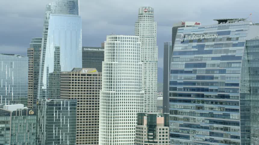 Skyscrapers in a city reach toward the sky