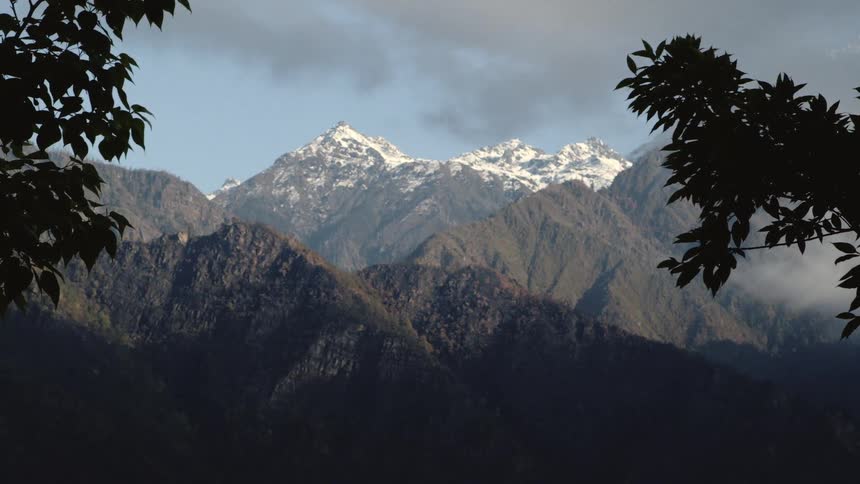 A mountain ridge with the top covered with snow