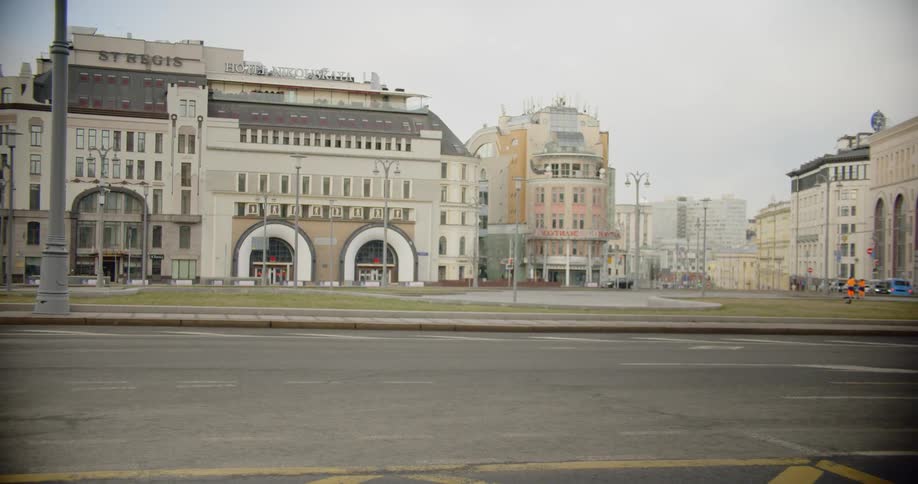A bus passes by buildings