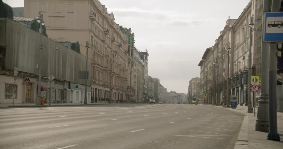 A car drives down a quiet street