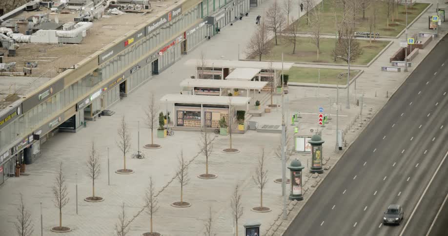 People walk along side a closed mall