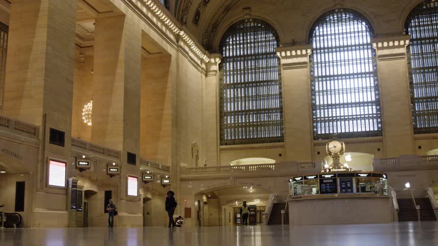People walking in an empty train station