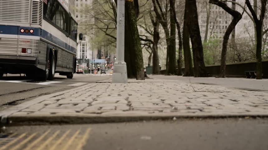 A bus drives down a city street