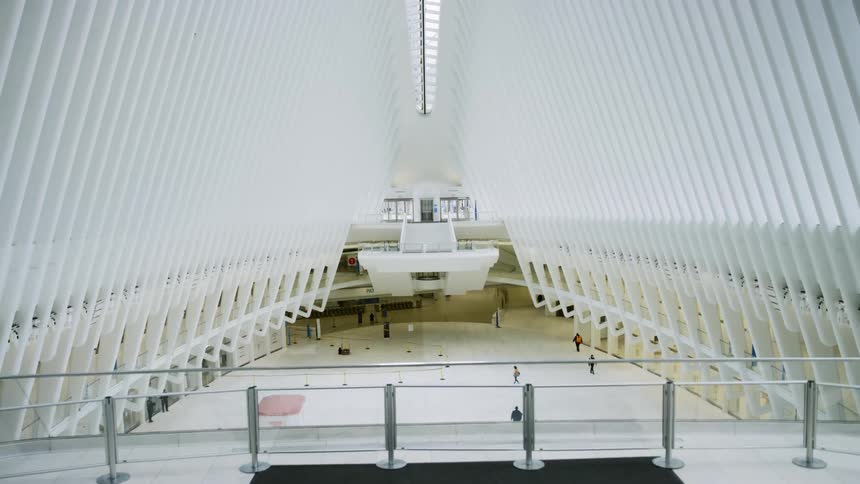 People walk inside an almost empty Oculus at World Trade Center