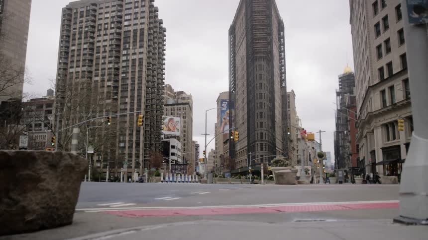 Single car drives through city empty streets