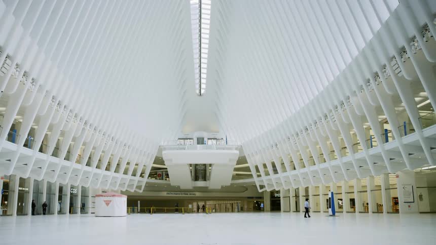 A single person walks through the empty Oculus at World Trade Center