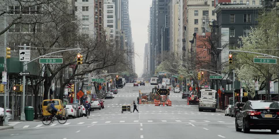 People travel down the street in the large city