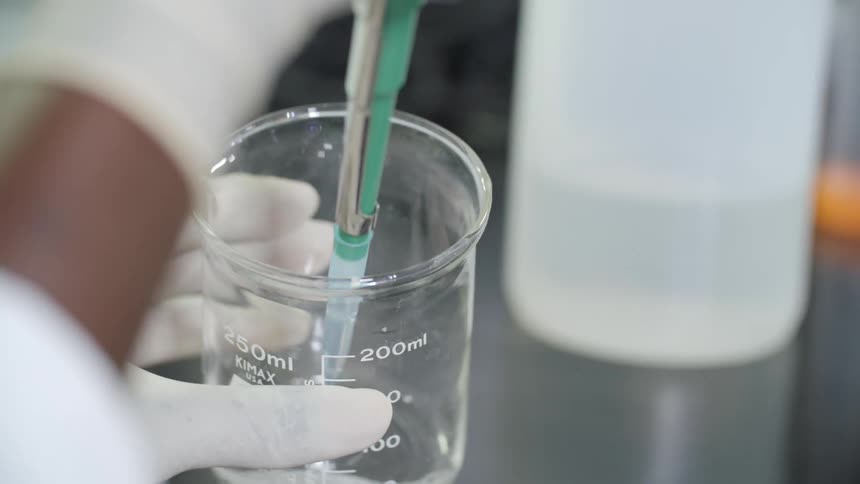 A technician takes a sample