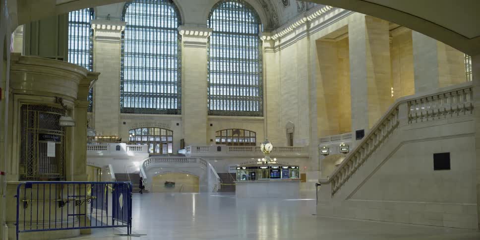 A lone person walks through the terminal