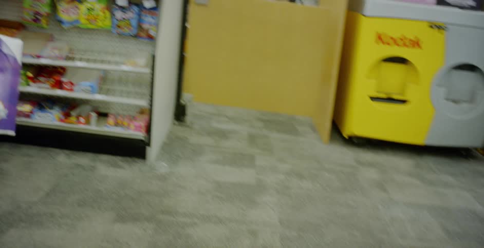 A man stands in line at checkout