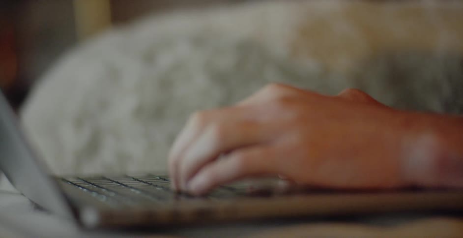 A person is using their laptop