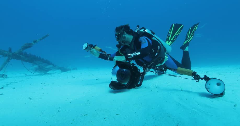 A diver handles his equipment underwater