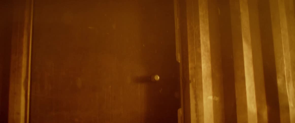 Door closed on a container with fire inside