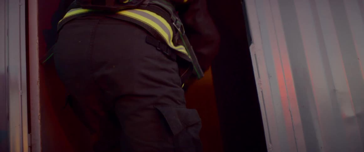A fireman is entering a building