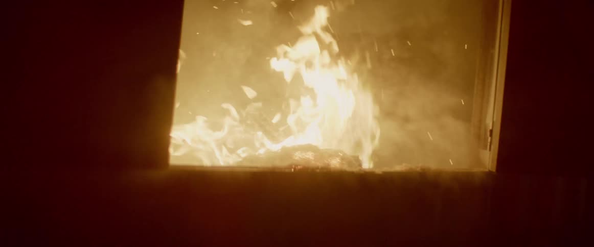 A fire burns in a building