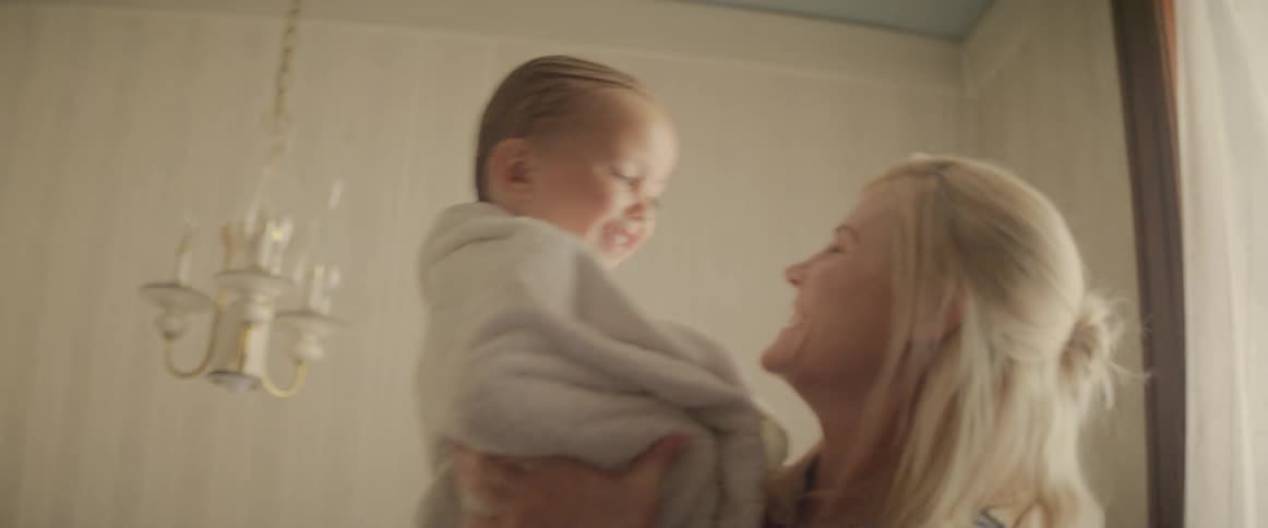 A mother picks up her child