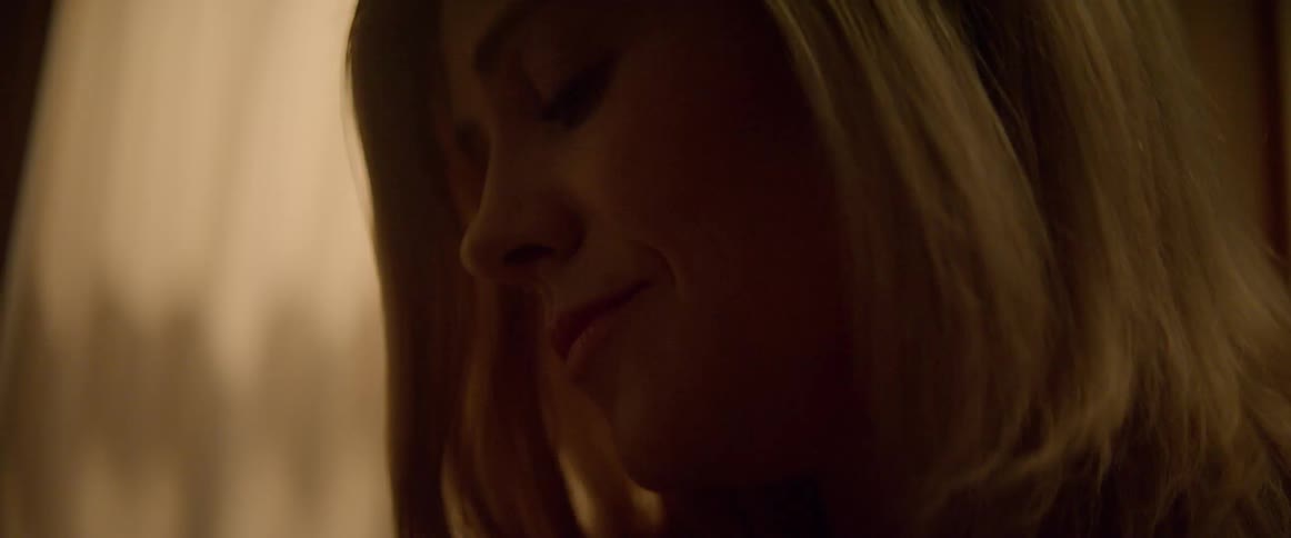 A mother gently rocking her baby