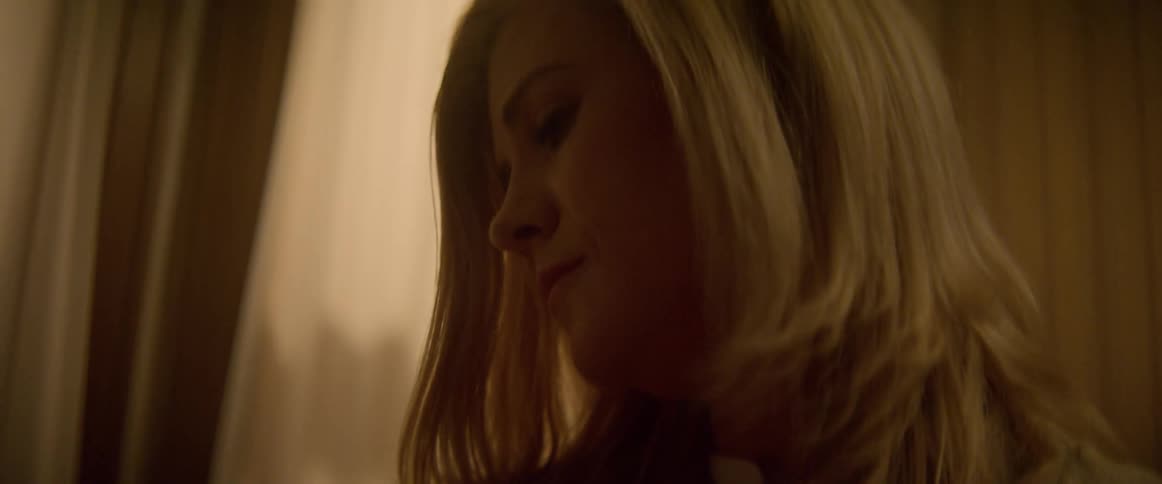 A mother gently rocking her baby