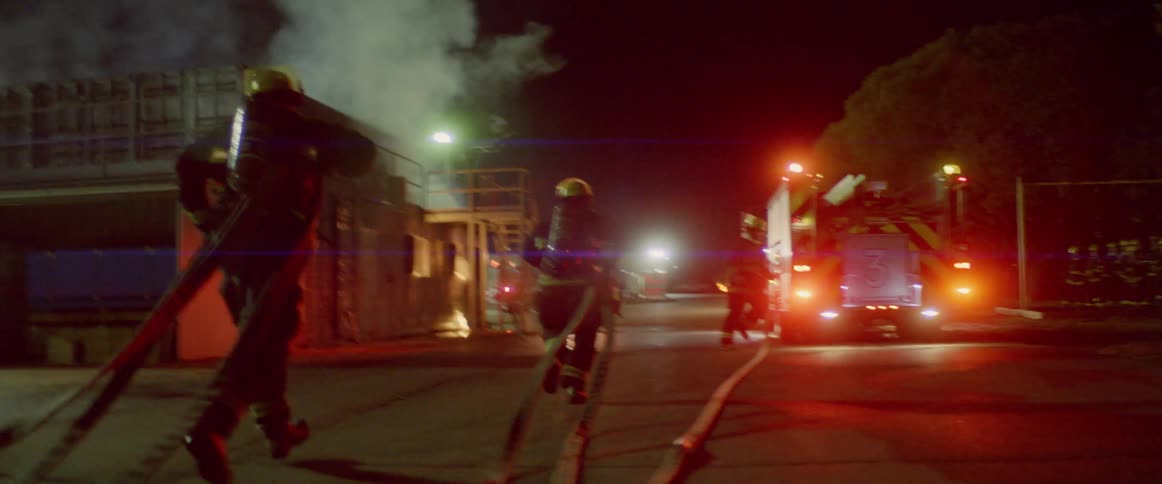 Firefighters rush to the scene of accident to put out the fire at night
