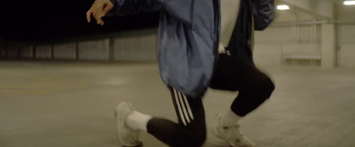 The man crouches up and down dancing