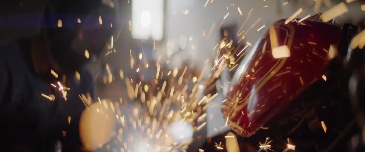 Sparks fly as someone does work on a motorcycle