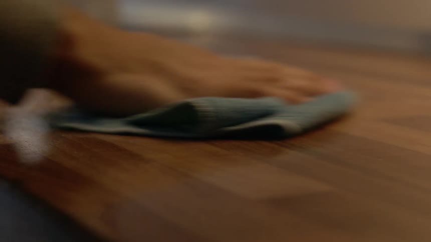 Man wipes kitchen table