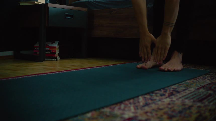 A person stretching touching their toes