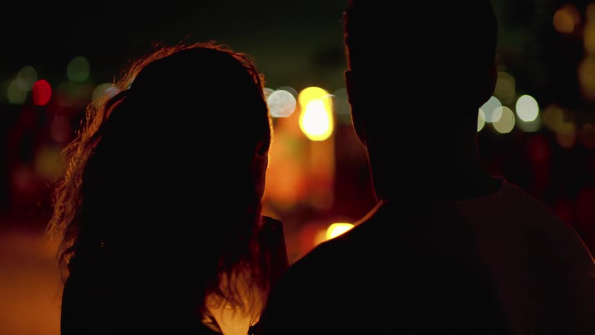 Couple watching a flame thrower during a luau show