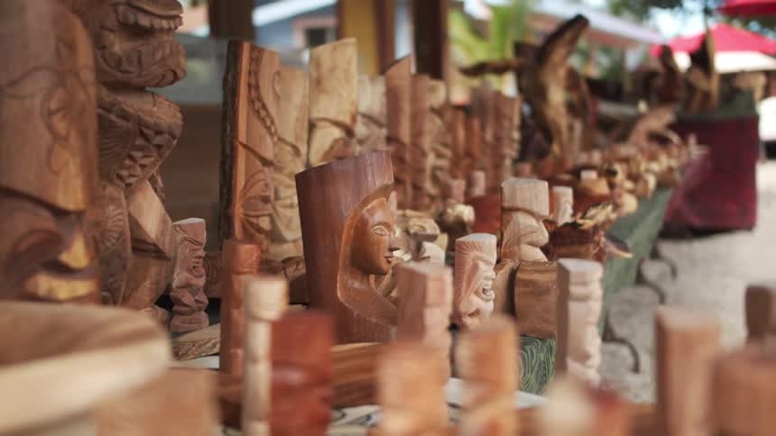Wooden sculptures resting on tables
